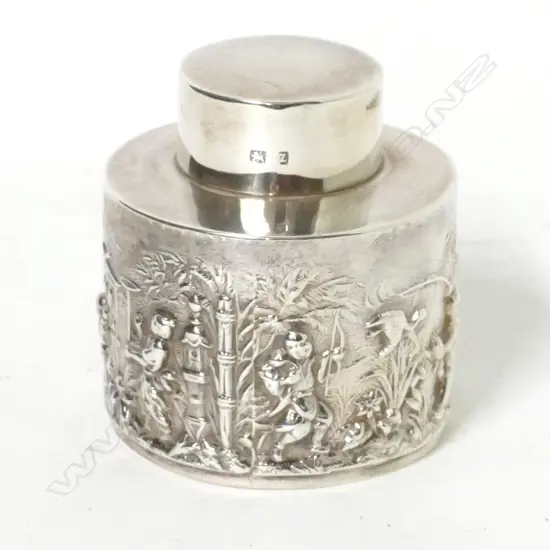 A small silver tea caddy