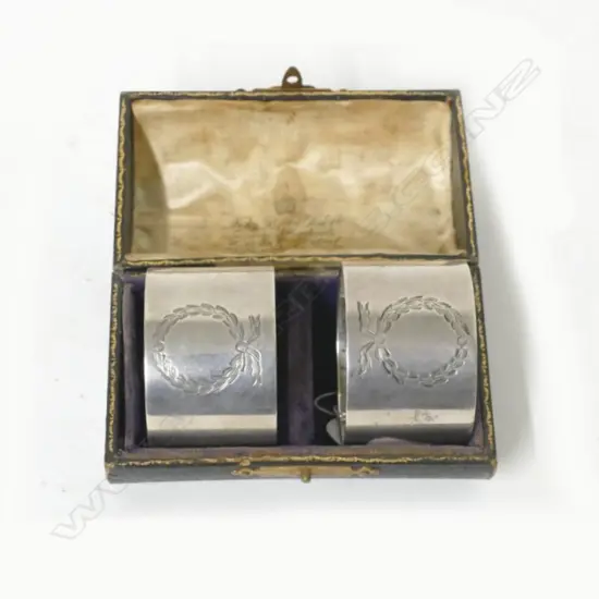 A boxed pair of heavy silver napkin rings