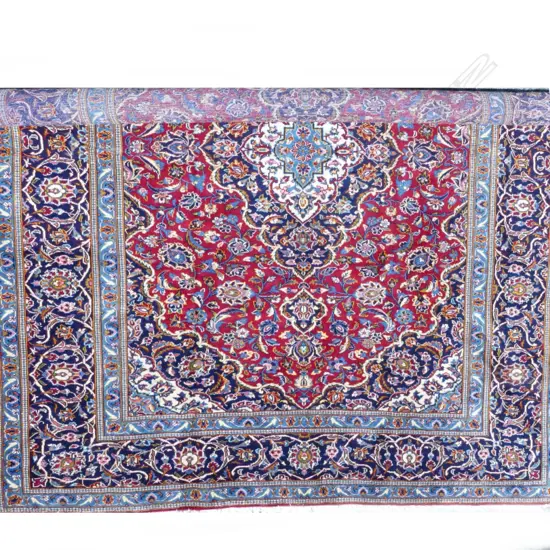 A large hand knotted Persian Kashan carpet