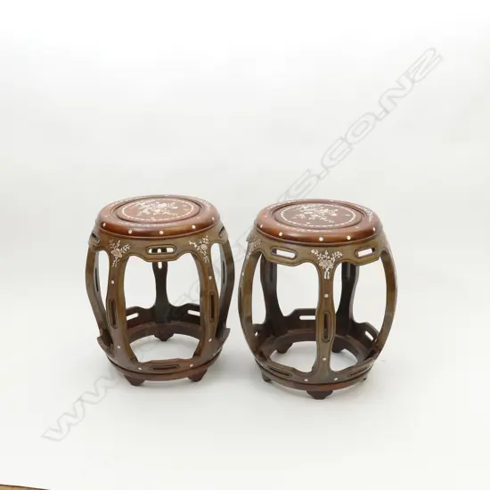 A pair of good quality Chinese hardwood drum stools of traditional design with profuse floral mother of pearl inlay. Diameter 350