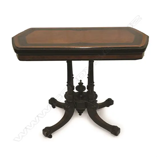 A Victorian birdseye maple and ebonized fold-over top games table
