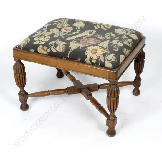 A vintage oak stool with turned and fluted legs