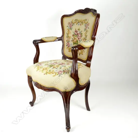 A 19thC French walnut open elbow chair of Louis XV style with cartouche back