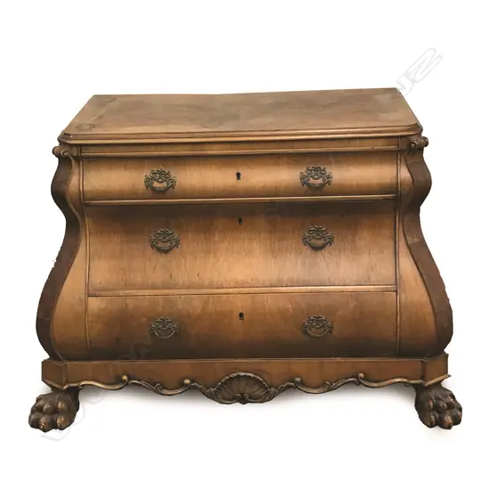An early 20thC German walnut bombe commode