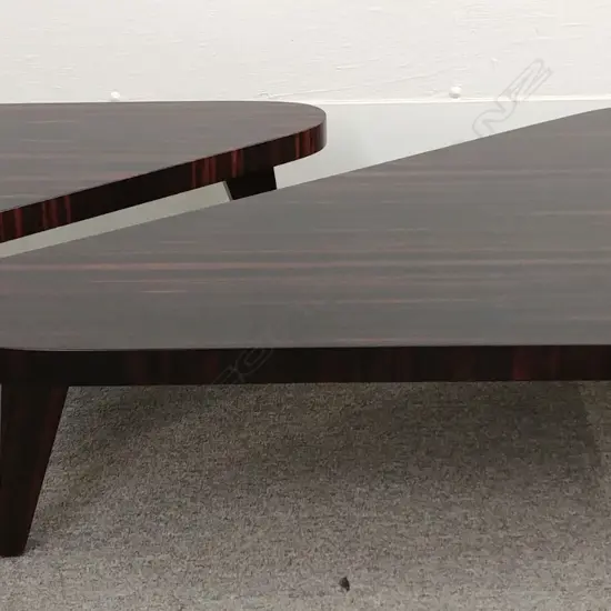 A contemporary two-piece ebony coffee table
