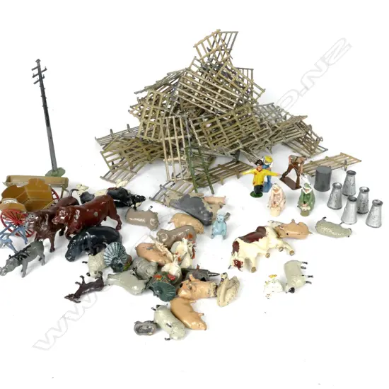 A selection of assorted vintage cast metal farm animals and people