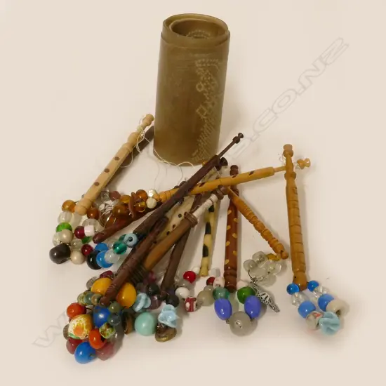 A collection of old beaded lace bobbins