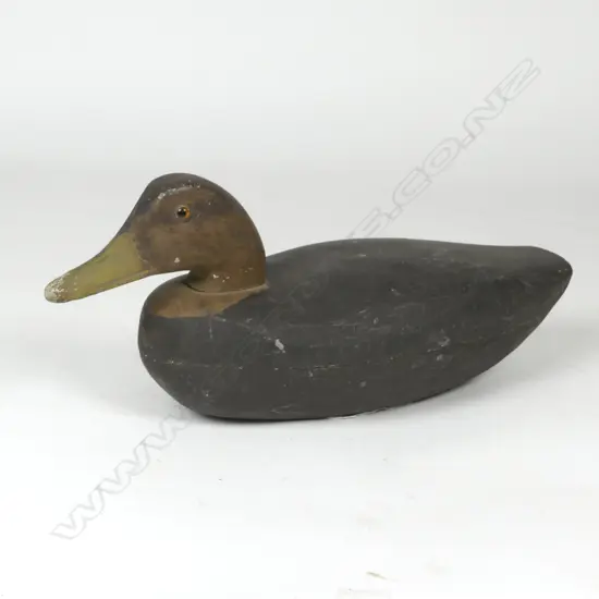A vintage wide bodied carved wooden decoy duck