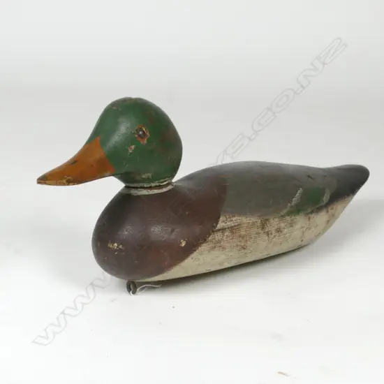 A vintage carved and painted wood duck decoy