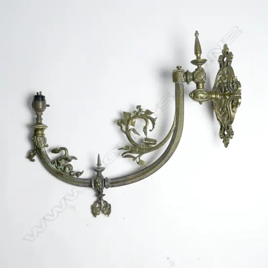 A Victorian brass gaslight wall fitting