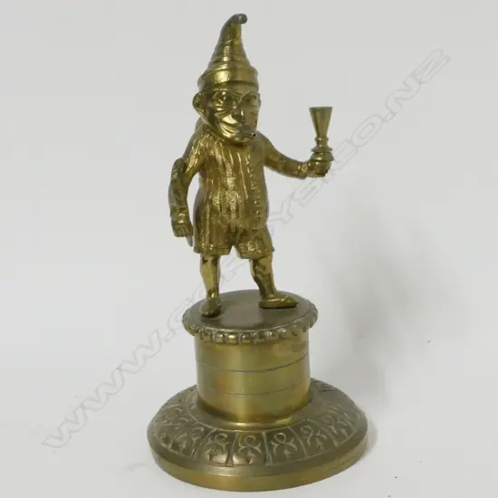 An early 1900s brass Mr. Punch cigar lighter