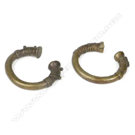 A pair of North African brass cuff bangles