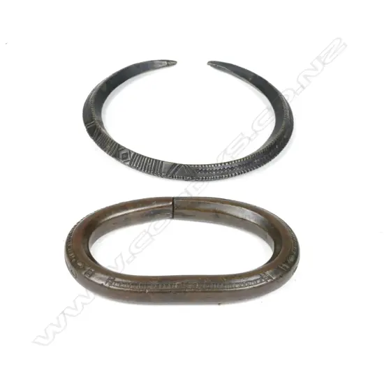 A North African brass bangle together with a brass slave cuff