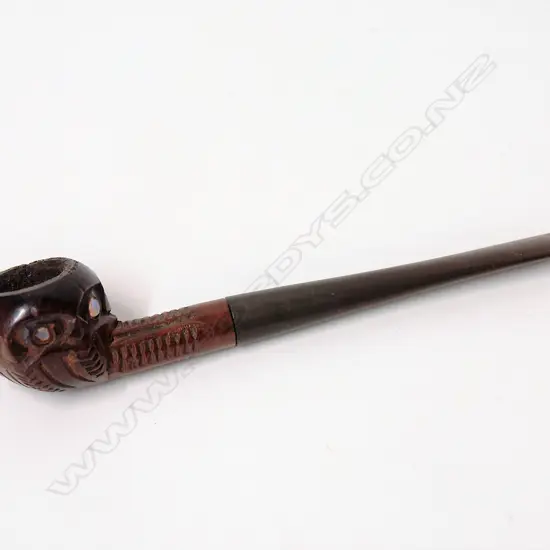 A vintage Maori carved pipe
