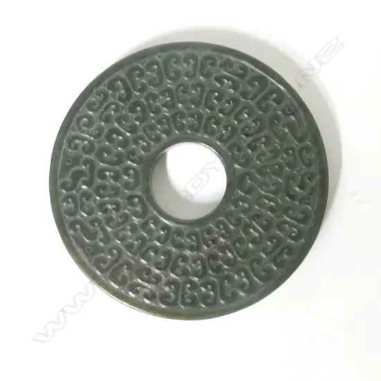 A Chinese dark green jade bi disc