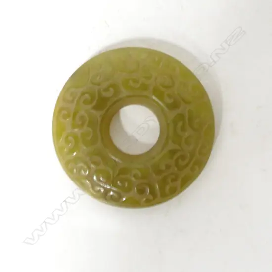A Chinese yellow/green jade bi disc