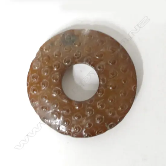 A Chinese brown jade bi disc