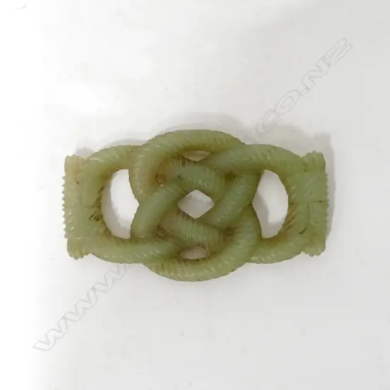 A Chinese carved jade costume piece