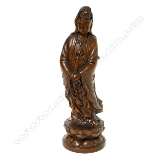 A carved figure of Kuanyin