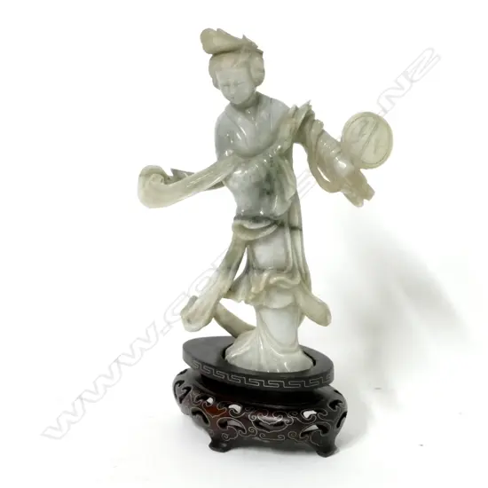 A Chinese carved jade figure of a woman