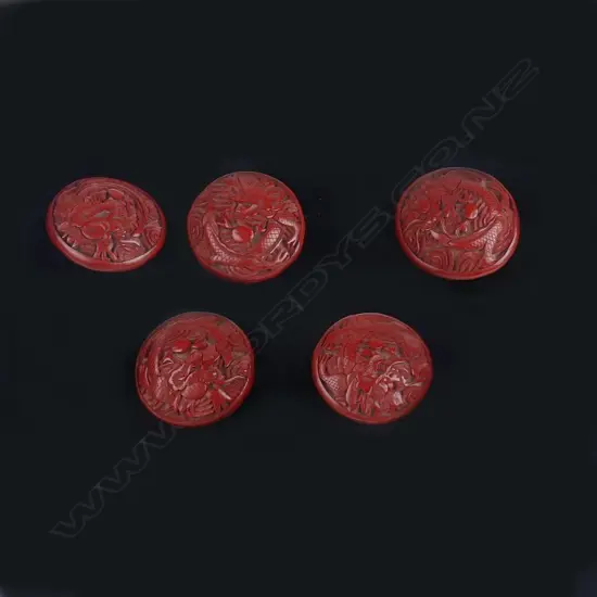 Five large cinnabar lacquer buttons