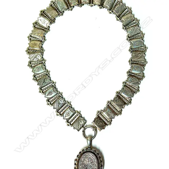A Victorian silver decorative wide neck chain and locket