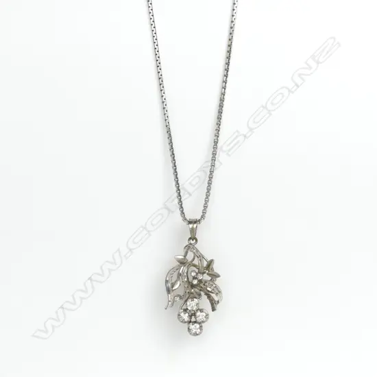 An 18ct. white gold and diamond pendant