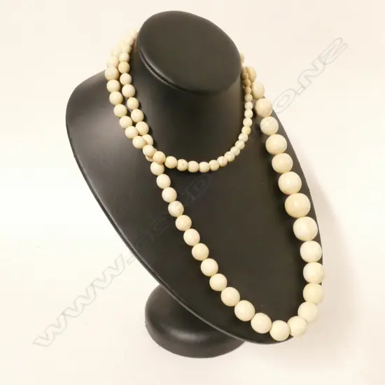 A long vintage ivory bead necklace