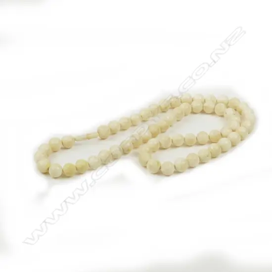 A vintage ivory bead necklace