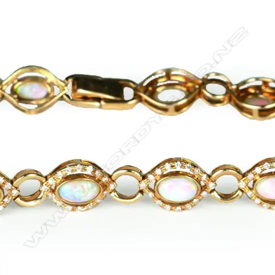 A stylish 18ct. yellow gold opal and diamond bracelet