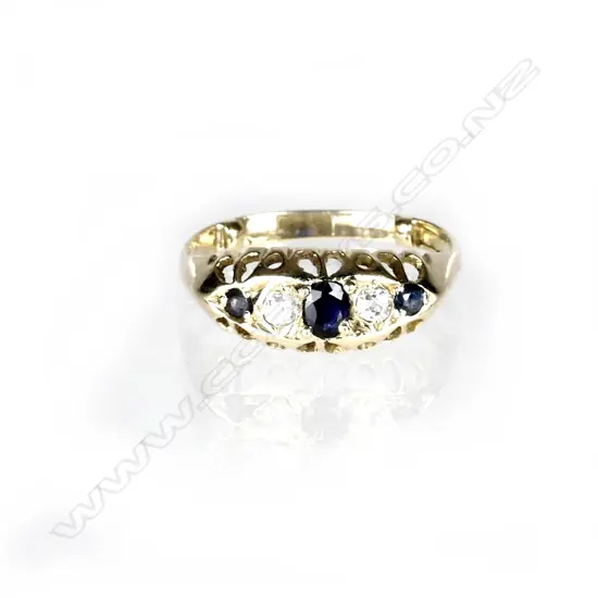 A lady's estate 18ct. yellow gold sapphire and diamond ring