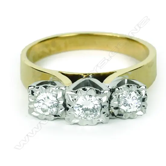 An 18ct. gold and three diamond ring