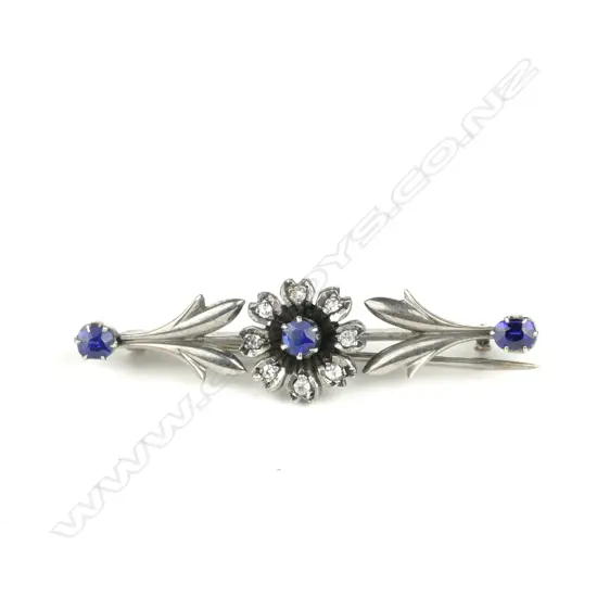 An 18ct. white gold and diamond brooch
