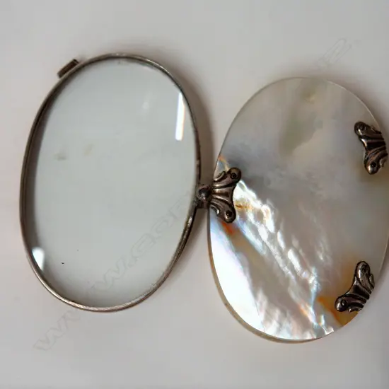 A 19thC European mother-of-pearl and silver magnifying glass
