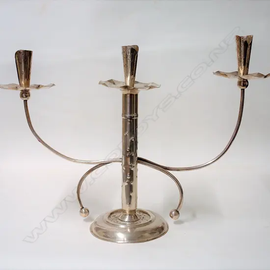 An uncommon N.Z. Arts & Crafts silver table candelabra