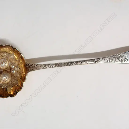 A George IV/Victorian silver berry sifting ladle