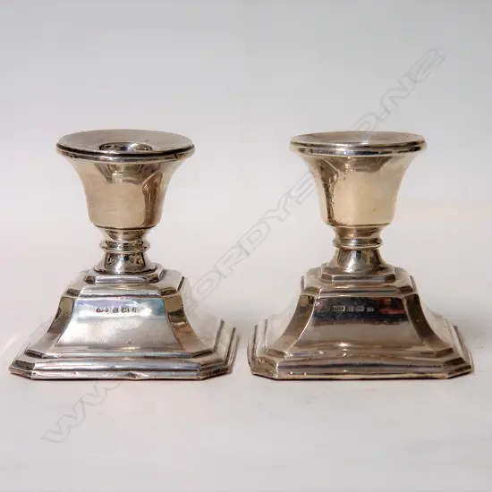 A pair of 1930s silver squat candlesticks