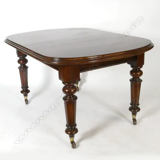 A Victorian mahogany D-end crank action extension dining table