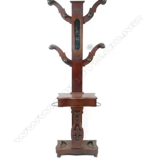 A Victorian mahogany four branch hall stand with eight turned coat pegs
