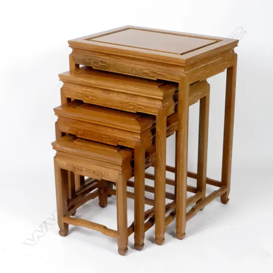 A nest of four Chinese teak side tables