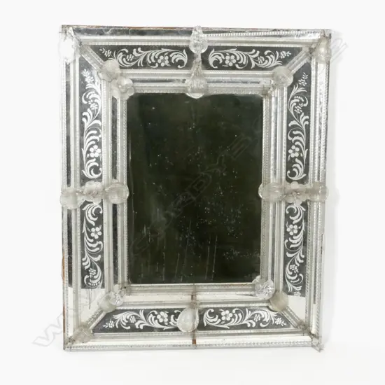 An old decorative Venetian mirror of oblong shape