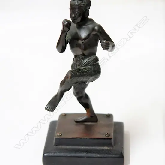 A small bronze figure of a Muay Thai fighter