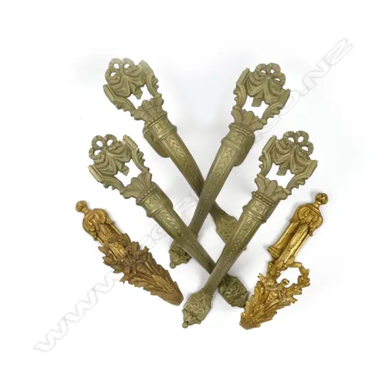 A pair of gilt metal curtain hooks