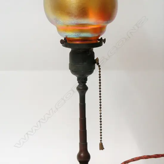 A c1900 Tiffany Studios New York bronze and Favril glass table lamp