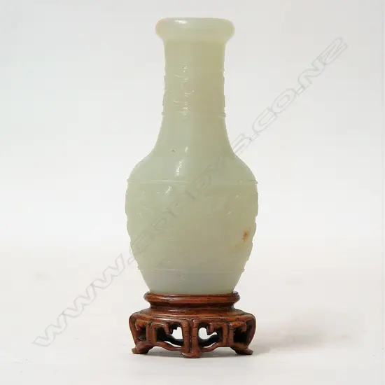 A Chinese pale carved mutton fat jade small bottle vase