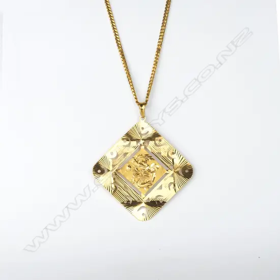 A 20ct. gold chain with 18ct. gold pendant