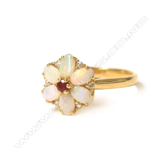 An 18ct. yellow gold opal ruby and diamond flower head cluster ring