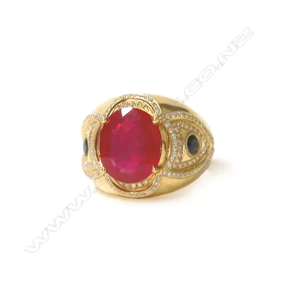 A substantial modern 18ct. yellow gold ruby diamond and sapphire dress ring