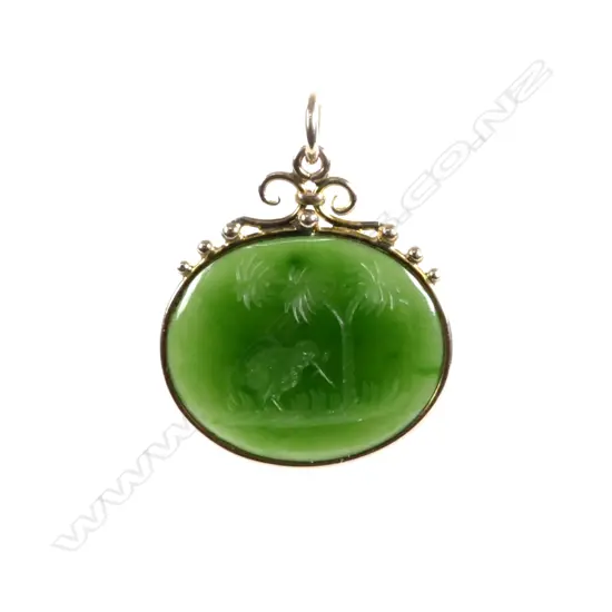 A colonial 9ct. rose gold frame pounamu pendant