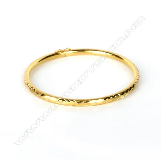 A 20ct. gold bangle